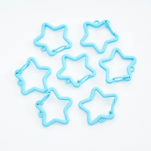 Macro detail of light blue star-shaped spring lobster clasps for DIY jewelry making
