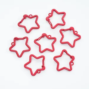Close-up view of red painted star-shaped lobster clasps for creative DIY jewelry making