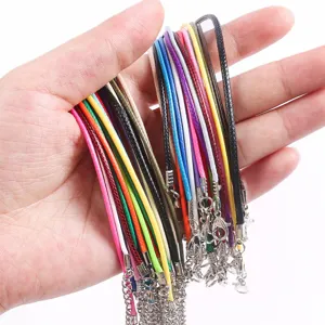 Detailed macro view showing a variety of colorful 1.5-2mm wax necklace cords with clasps