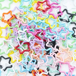 Pile of colorful star-shaped metal snap hooks for DIY jewelry and keychain crafts
