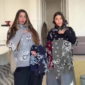 Cozy paisley knit sweaters showcased by two models in a lifestyle setting