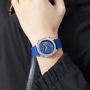 Detail of Scottie 3012B men's chronograph quartz watch with blue silicone strap on wrist