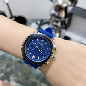 Close-up of Scottie men's blue dial chronograph watch with blue silicone strap on wrist