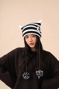 Cute black and white striped cat ear beanie with star patch and pompom strings for women