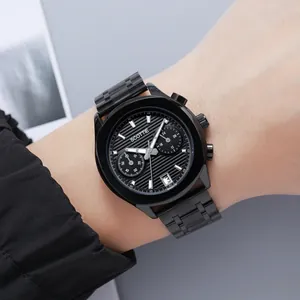 Macro detail of Scottie men's black chronograph quartz watch with three sub-dials on wrist