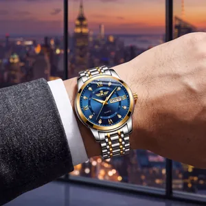 Macro view of luxury men's blue dial quartz watch with gold and silver steel strap.