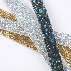 Detail close-up of self-adhesive resin rhinestone strips in multi-colors for DIY crafts and apparel.