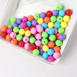 Detailed view of colorful acrylic solid round beads for DIY handmade jewelry crafting and beading.