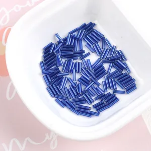 Close-up of 2x7mm blue glass bugle beads for DIY jewelry and garment hand-sewing