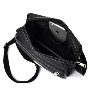 Black oxford cloth shoulder bag for men with internal storage compartment detail
