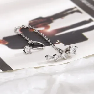 Elegante set di orecchini e polsino in argento con scintillanti pietre di zircone cubico