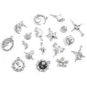 Detailed view of various silver alloy charms including stars, moons, and hearts for DIY