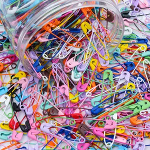 Colorful alloy safety pins spilling from jar, perfect for DIY jewelry and sewing craft projects.