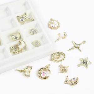 Variety of gold-plated alloy charms including stars, moons, and hearts for DIY jewelry