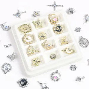 Detailed macro view of assorted gold and silver alloy charms in star, heart, and moon shapes