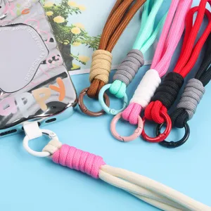 Close-up of colorful braided phone lanyards with secure ring clips for accessories.