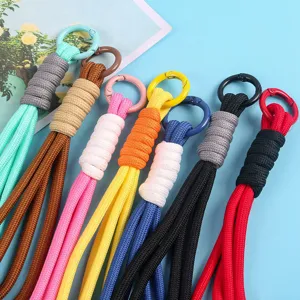 Close-up of colorful handmade braided phone lanyards in various vibrant shades.