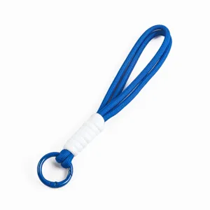 Detail of 16cm blue and white handmade braided phone lanyard with circular clasp