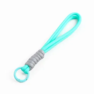 Close-up detail of 16cm mint green hand-woven lanyard with a matching circular carabiner