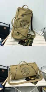 Versatile khaki canvas duffel bag shown in a stylish lifestyle camping setting
