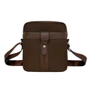 Premium brown Oxford cloth men's crossbody bag with adjustable shoulder strap and logo