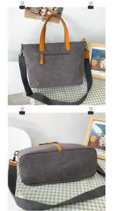 Détail du grand sac cabas en toile avec poignées orange et fond large structuré