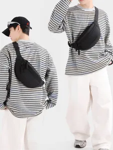 Versatile black unisex sports chest bag displayed in front and back views on model