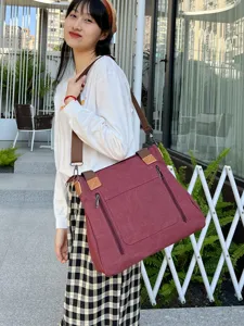 Vintage large burgundy canvas tote bag with multi-pocket design for women's daily commute