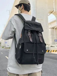 Black canvas drawstring backpack for outdoor travel and school in street style fashion