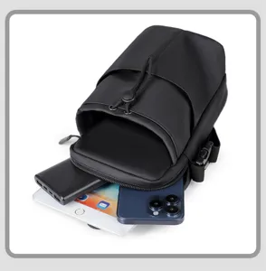 Detailed view of spacious compartments holding a tablet, smartphone, and power bank.