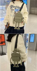 Creative green frog crossbody chest bag with cute cartoon design and adjustable strap