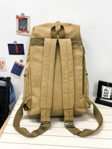Durable khaki canvas backpack with adjustable wide shoulder straps for casual travel use
