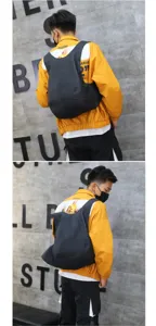 Detailed view of the black minimalist anti-theft backpack on a model's back