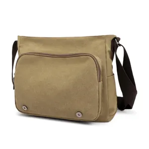 Close-up of a khaki canvas messenger bag with front zipper pocket and metal snaps