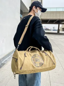 Durable khaki canvas barrel duffel bag for travel and gym with adjustable shoulder strap