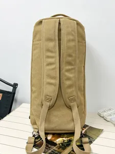 Durable khaki canvas cylinder backpack for travel and gym, rear view showing straps.