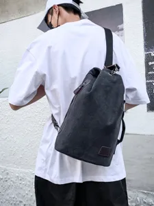 Stylish black canvas crossbody bag for men in casual urban street style