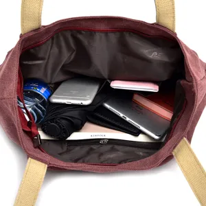 Internal view of large capacity canvas tote bag showing organized storage space.
