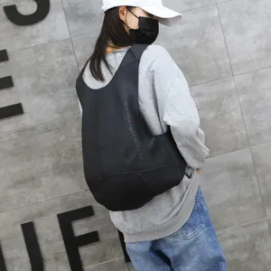 Stylish black anti-theft backpack for students with unique vest-shaped design
