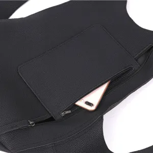 Black pebbled leather anti-theft backpack detail with a hidden back zipper pocket