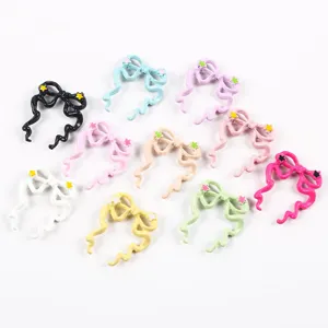 Variety of colorful drip oil alloy bow charms with wavy streamers and star details
