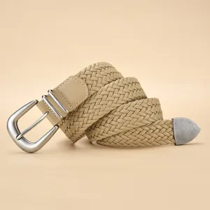 Close-up of beige braided PU belt with vintage silver-toned metal buckle and tip