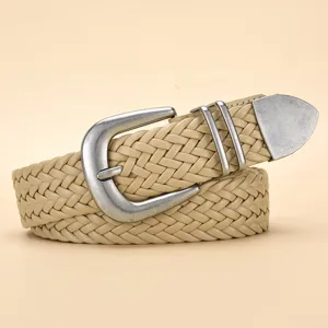 Close-up detail of vintage beige PU braided belt with silver metal pin buckle