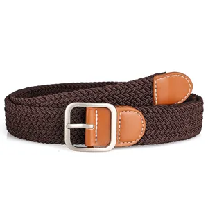 Detail shot of brown woven elastic belt showing metal pin buckle and textured braided strap.