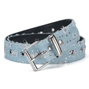 Punk style light blue distressed denim belt with star eyelets, sequins and silver buckle.