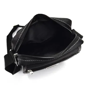 Men's black oxford cloth crossbody bag with spacious interior compartment and zip