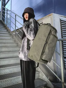 Heavy-duty olive green canvas cylinder backpack with large capacity for travel and outdoor sports