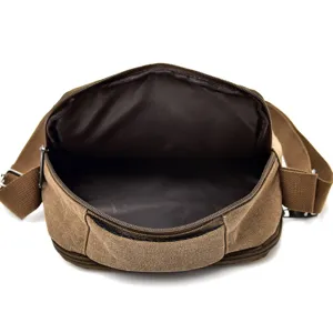 Durable brown canvas messenger bag for men featuring a spacious multi-compartment interior