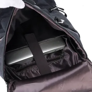 Interior view of large capacity black canvas travel backpack with laptop compartment