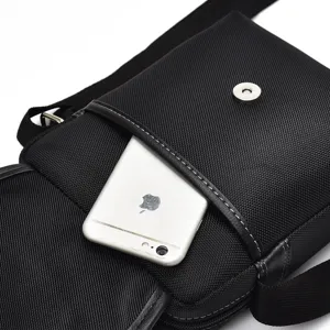 Black men's Oxford cloth crossbody bag with front pocket for smartphone storage